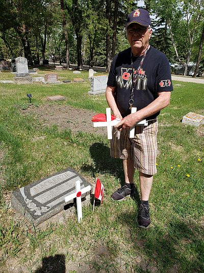 Placing crosses and flag on graves