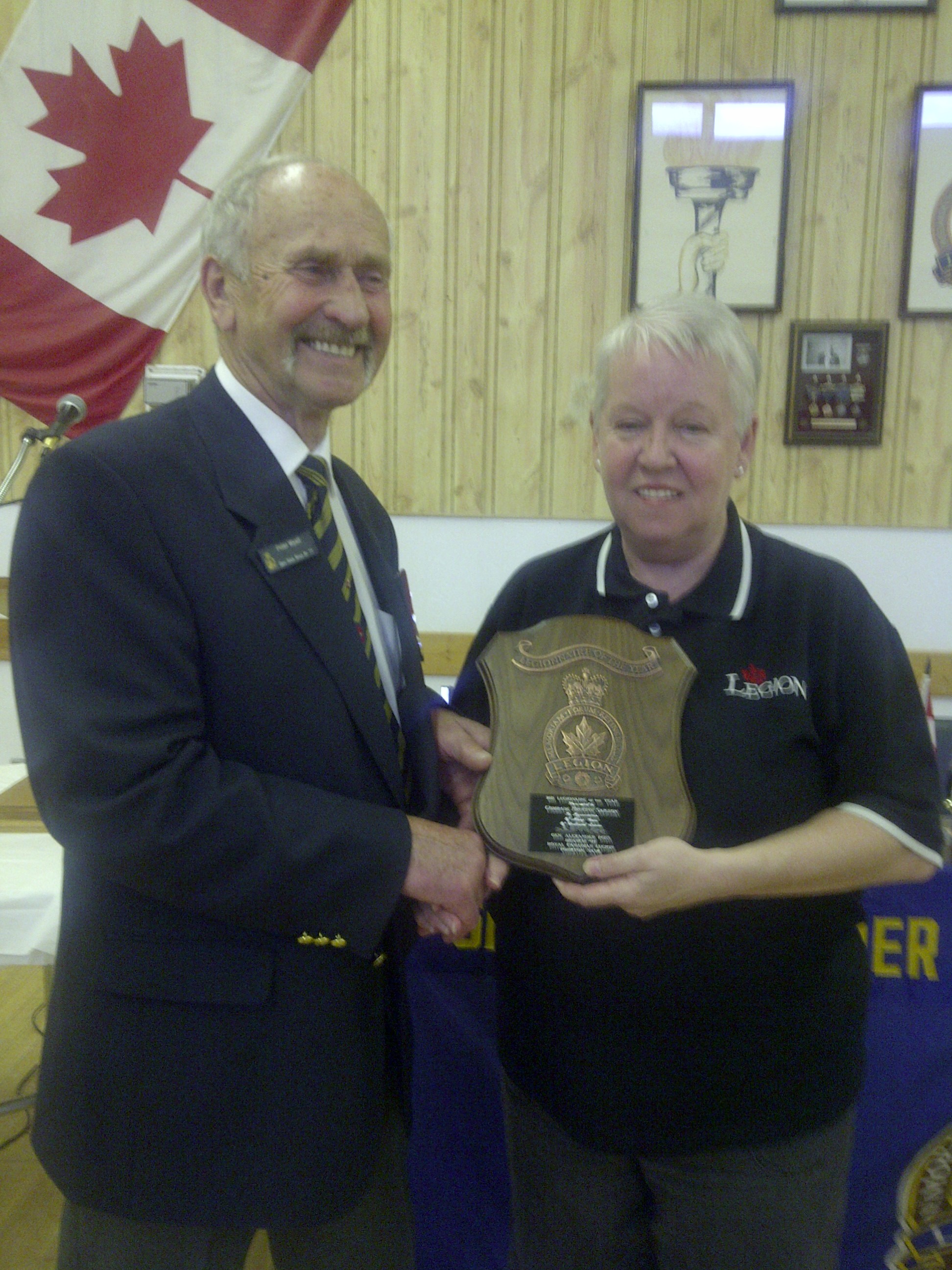 Comrade Brucine Saigeion recieving the 2011 Legionaire of the Year award from Comrade President Peter Wyatt.