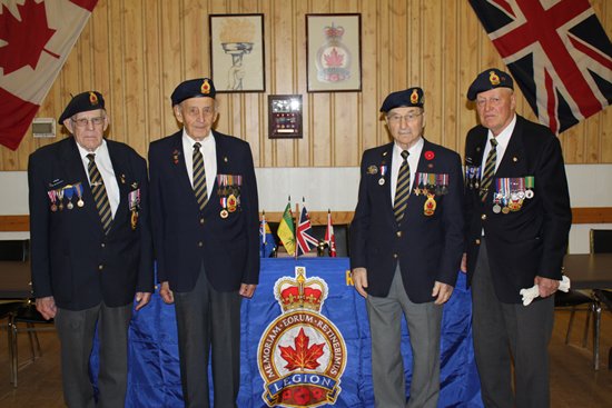 2009 Surviving D-Day Veterans. From L to R Comrades Al Morley, Wm Winnitony, Mike Derkatch, and John Miller.  (Photo provided by the News Review)
